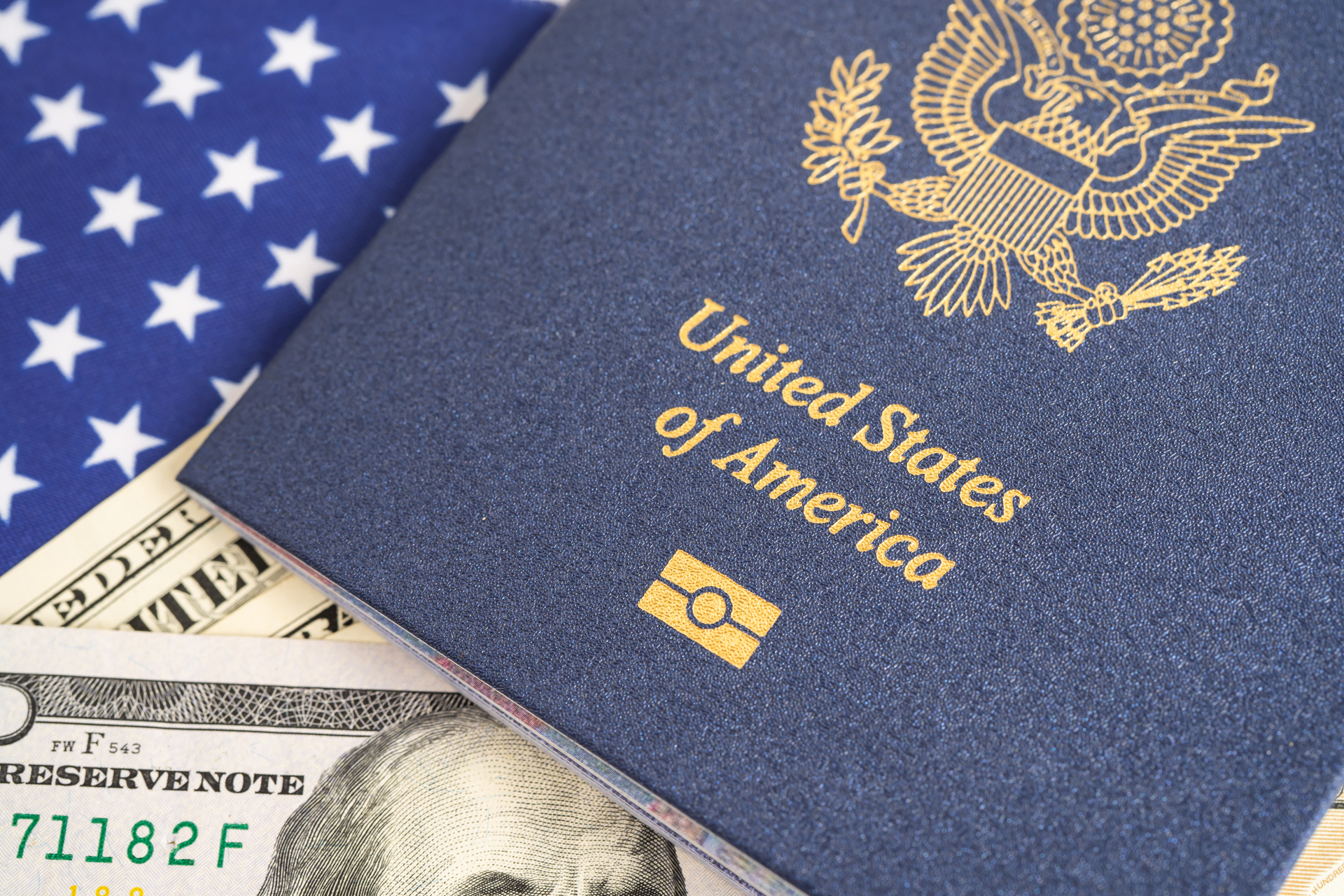 US passport issued to citizen and national of the United States of America to travel in most countries outside with USA flag and dollar money.